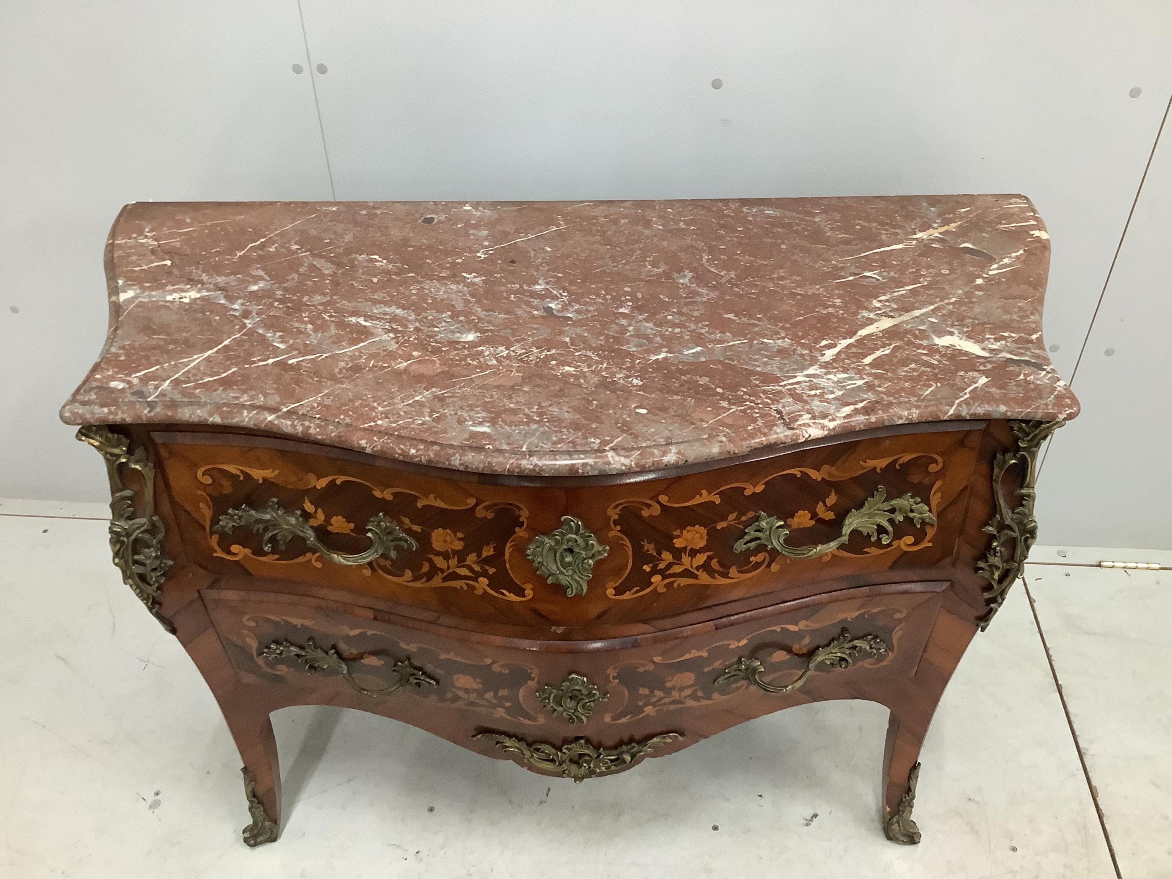 A French gilt metal mounted and marquetry inlaid kingwood marble topped serpentine commode, width 116cm, depth 51cm, height 85cm. Condition - fair to good